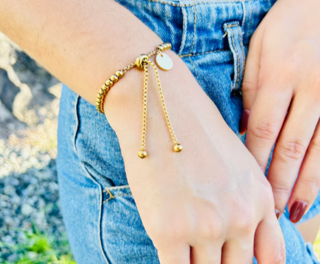 ADJUSTABLE BRACELET IN GOLD-COLORED STAINLESS STEEL